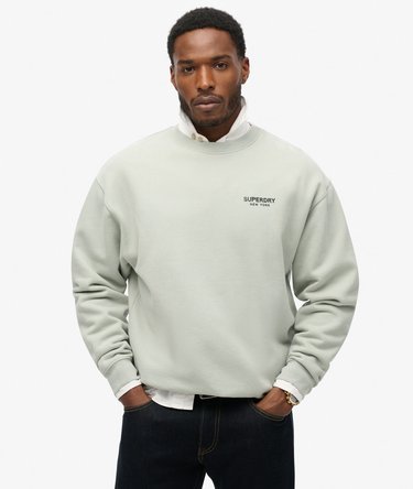 Model wearing an orange t-shirt on a white studio background